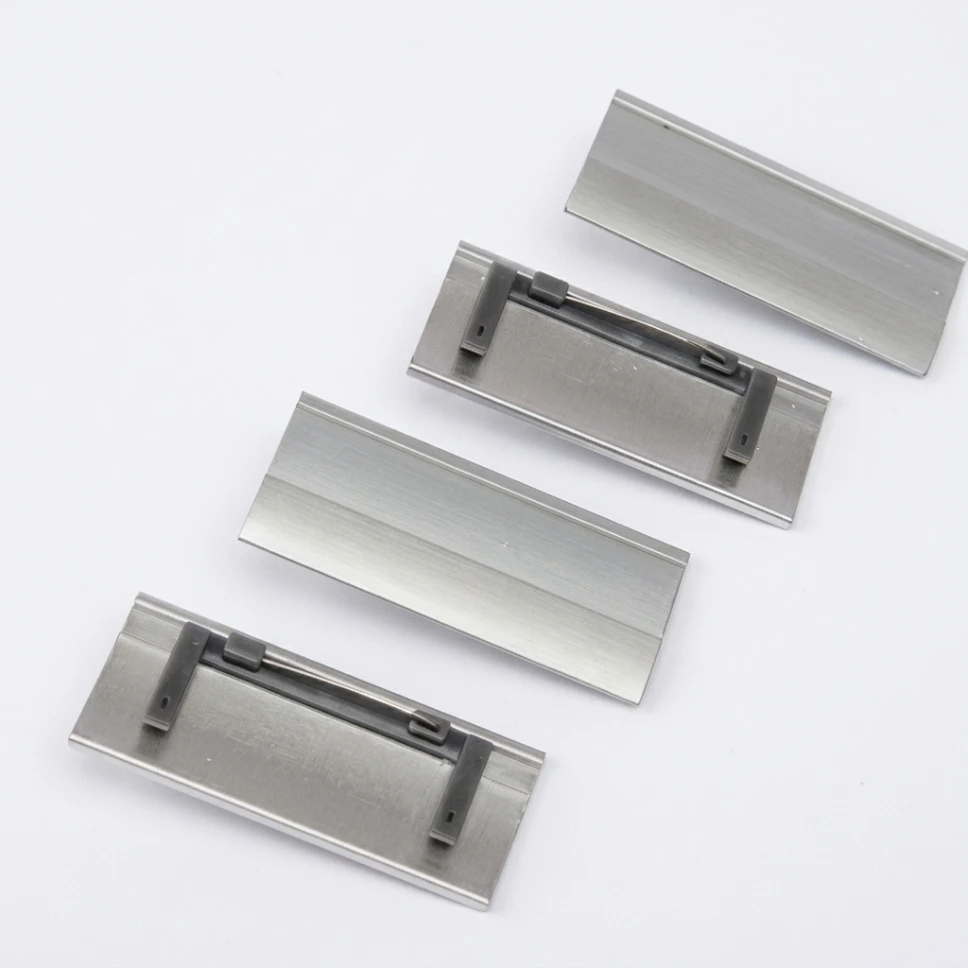 Replaceable Name Tags in Gold and Silver Finishes